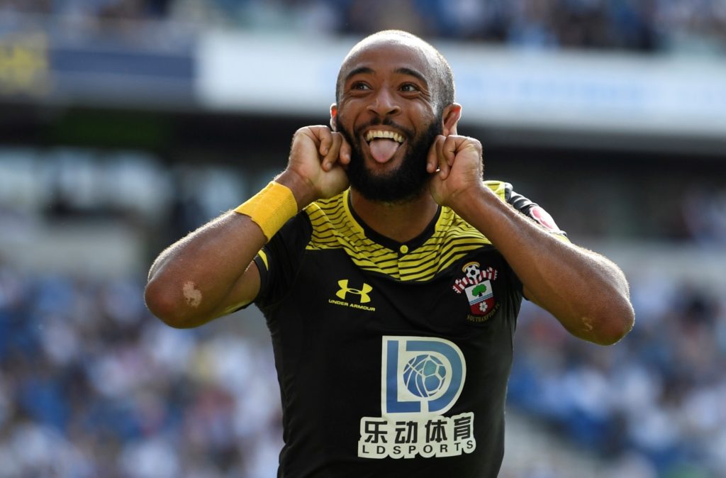 Moussa Djenepo and Nathan Redmond were on target as Southampton clinched a 2-0 victory at 10-man Brighton.