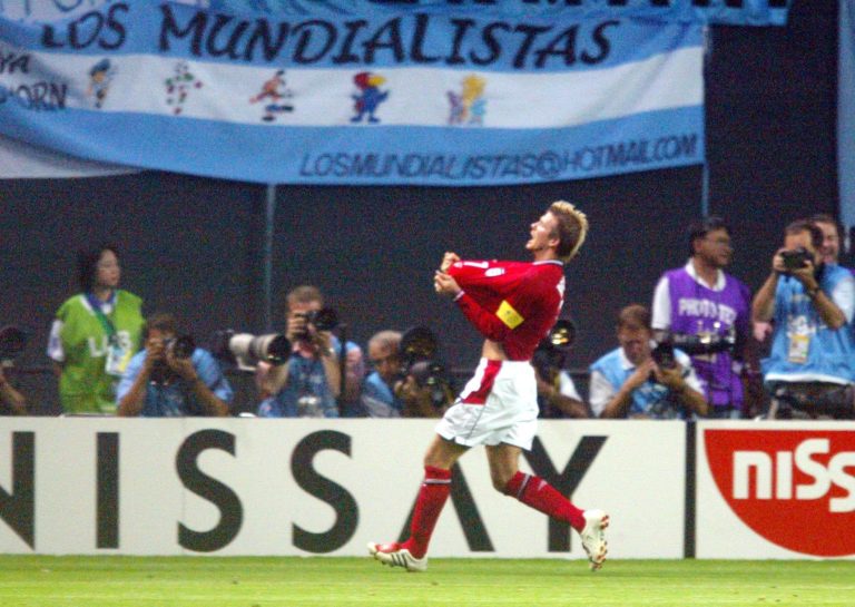 England captain David Beckham celebrates scoring against Argentina