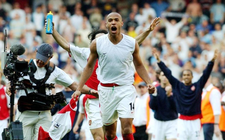 Thierry Henry celebrates with the visiting fans at White Hart Lane 