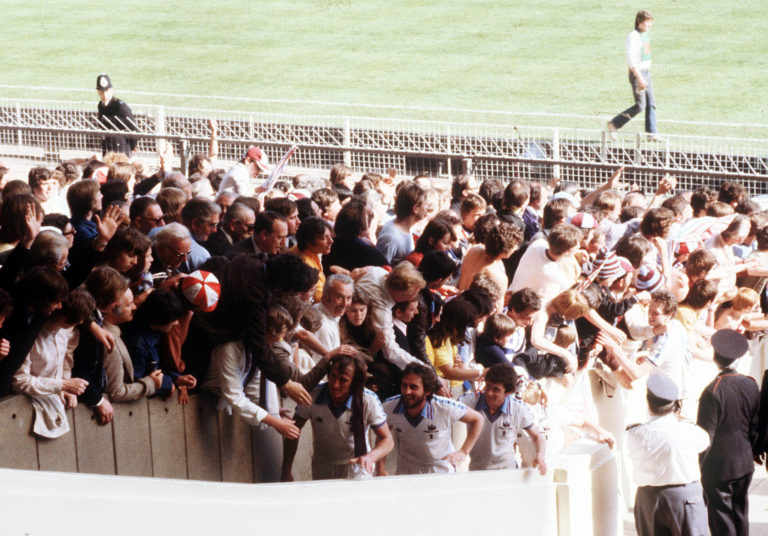 West Ham are congratulated by fans as they climb the steps to receive the FA Cup