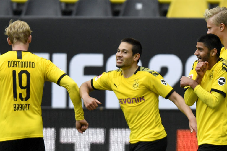 Dortmund's Raphael Guerreiro celebrates with Julian Brandt after scoring his side's second goal