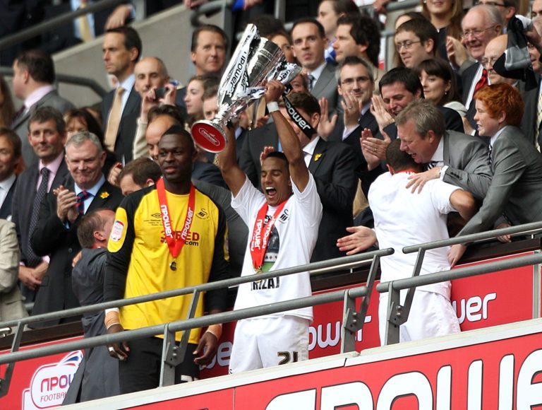 Scott Sinclair holds the Championship play-off trophy aloft