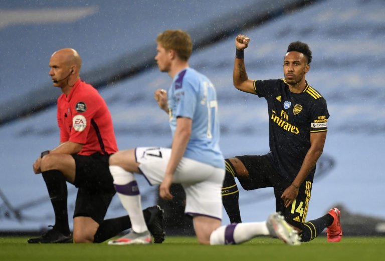 Arsenal's Pierre-Emerick Aubameyang, right, and Manchester City's Kevin De Bruyne, take the knee after the kick-off of their Premier League match on Wednesday 