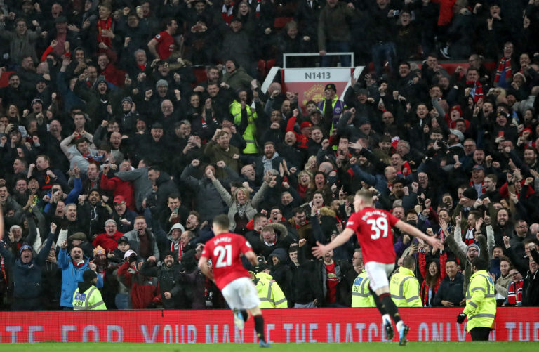 Scott McTominay celebrates scoring Manchester United's second against Manchester City in March