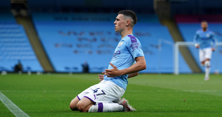 Manchester City's Phil Foden celebrates after scoring his side's third goal against Liverpool