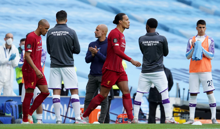 Liverpool are given a guard of honour by former champions Manchester City. The Reds arrived at the Etihad Stadium with the title sewn up after City lost 2-1 at Chelsea in their previous league match. Virgil Van Dijk and Fabinho, pictured, had endured an evening to forget as Pep Guardiola's hosts exacted a modicum of revenge with a thumping 4-0 success