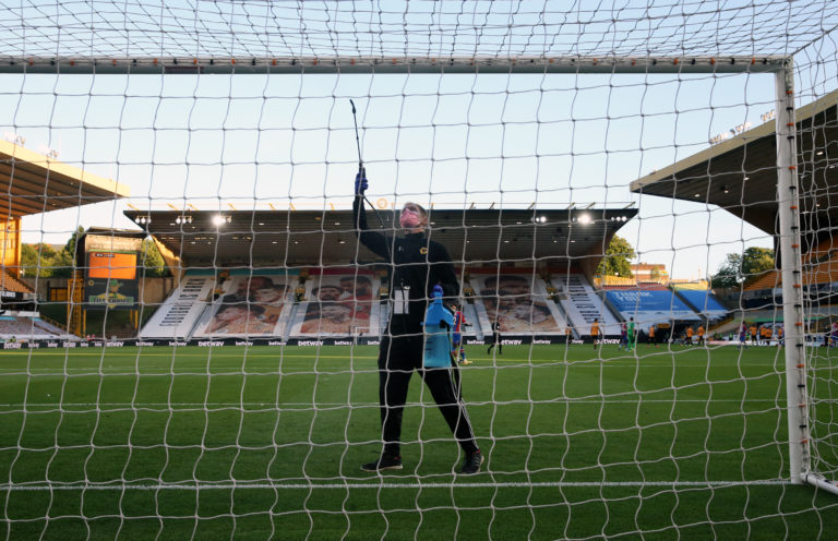 A steward disinfects the crossbar at Molineux ahead of Wolves' clash with Crystal Palace. The task became a regular occurrence at grounds across the country in the wake of the coronavirus pandemic which prompted play to be suspended for more than three months