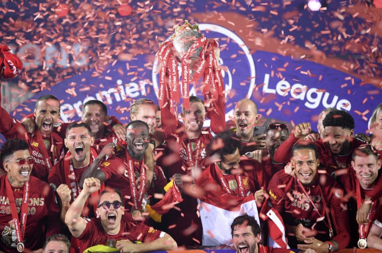 Liverpool captain Jordan Henderson lifts the Premier League trophy after an entertaining 5-3 win over Chelsea. Henderson became the first Reds skipper in 30 years to lead the club to the title. Jurgen Klopp's men celebrated wildly at an empty Anfield as coronavirus restrictions prevented supporters from attending the presentation ceremony